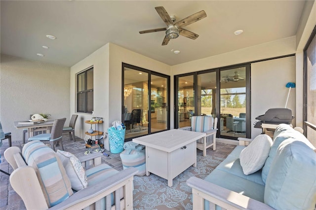 view of patio featuring an outdoor living space and ceiling fan