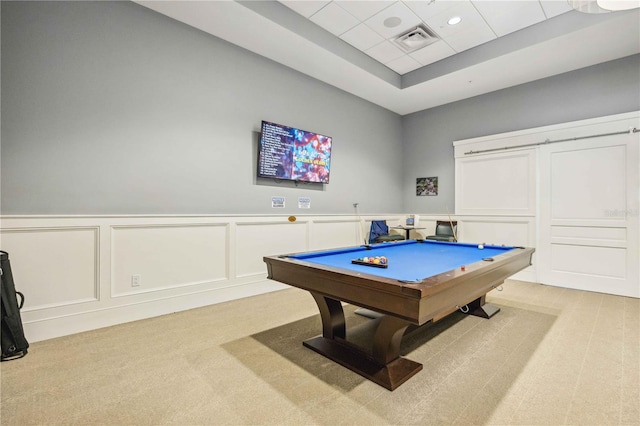 game room with a raised ceiling, light colored carpet, and billiards