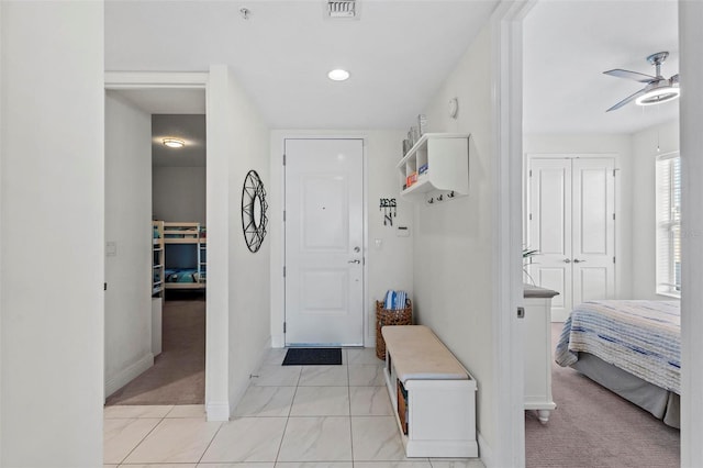 interior space featuring ceiling fan