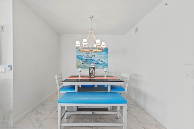 dining area featuring a notable chandelier