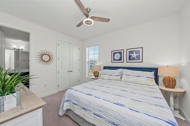 carpeted bedroom featuring a closet and ceiling fan