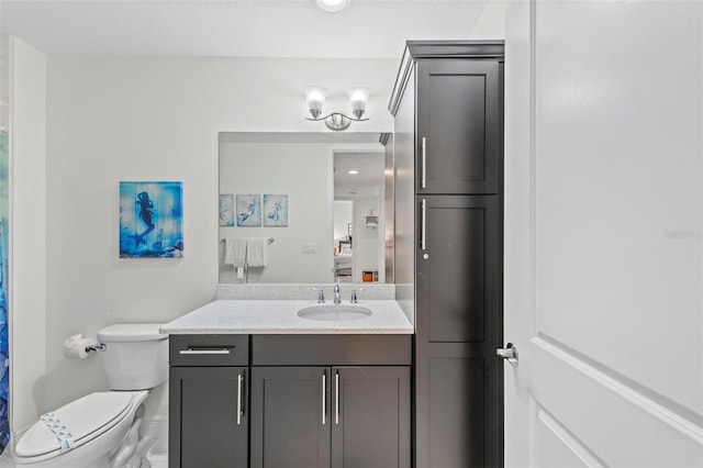 bathroom with vanity and toilet