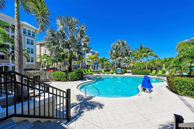 view of swimming pool with a patio