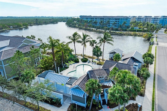 birds eye view of property with a water view