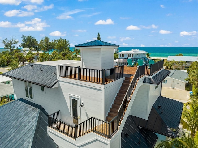 exterior space featuring a water view and a balcony