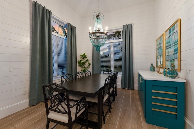 dining area featuring a notable chandelier