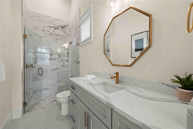 bathroom with vanity, toilet, and a shower with shower door