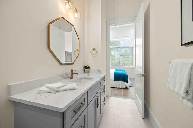 bathroom featuring tile patterned flooring and vanity