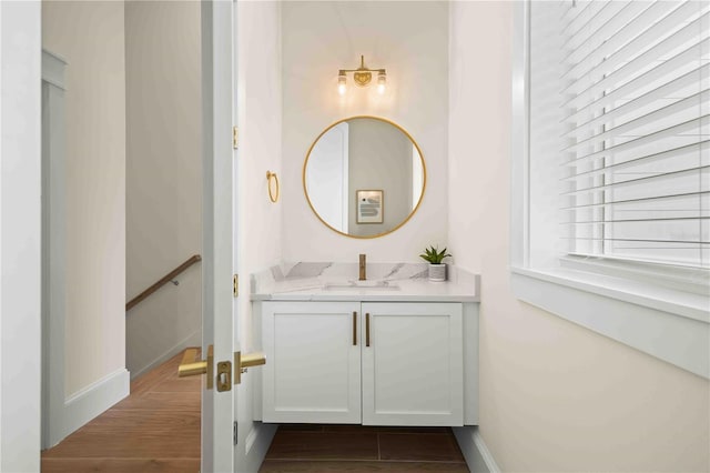 bathroom with vanity and wood-type flooring