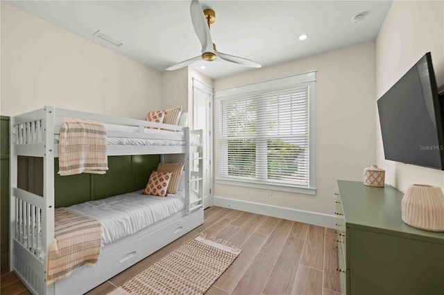 bedroom featuring ceiling fan and hardwood / wood-style flooring