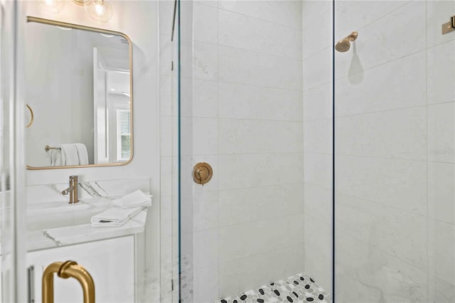 bathroom featuring a shower with shower door