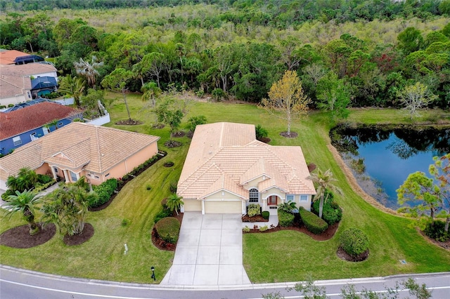 birds eye view of property with a water view