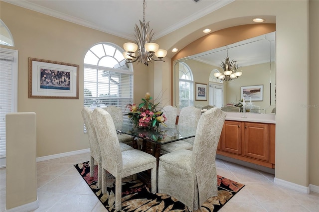 tiled dining space featuring crown molding and an inviting chandelier