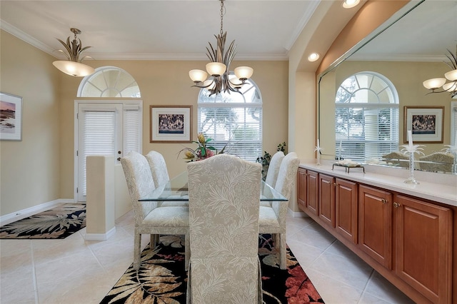 dining area featuring crown molding, plenty of natural light, and a chandelier