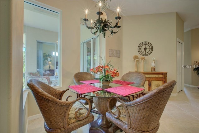 tiled dining area with a healthy amount of sunlight and a notable chandelier