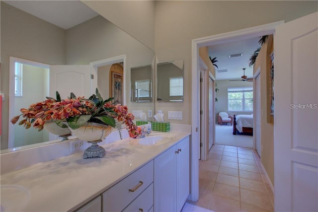 bathroom featuring ceiling fan, tile patterned flooring, and vanity