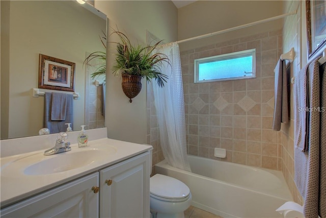 full bathroom featuring shower / bath combination with curtain, vanity, and toilet