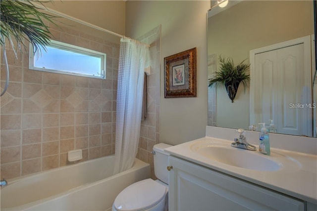 full bathroom with shower / tub combo with curtain, vanity, and toilet