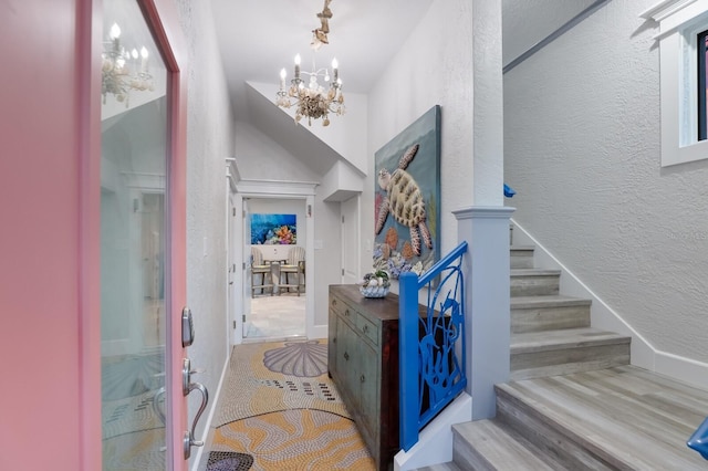 foyer featuring light hardwood / wood-style flooring and an inviting chandelier