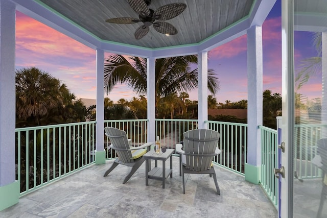 sunroom / solarium featuring ceiling fan and wood ceiling