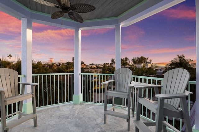 sunroom featuring ceiling fan