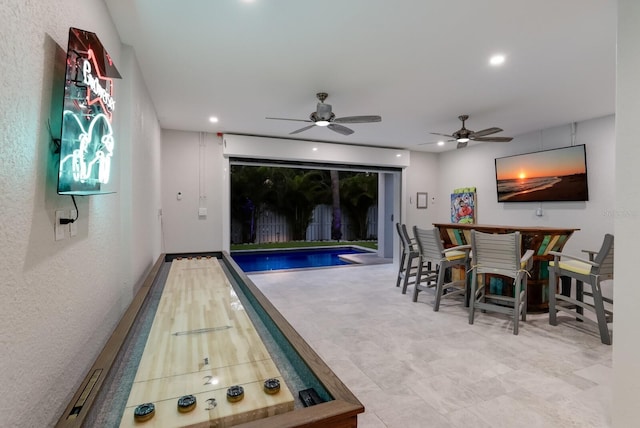 view of pool featuring ceiling fan