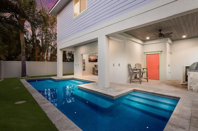 view of swimming pool featuring ceiling fan