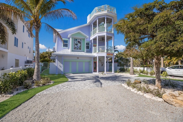 view of front of house featuring a balcony and a garage