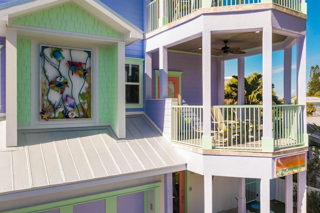 exterior space featuring ceiling fan and a balcony