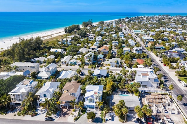 aerial view featuring a view of the beach and a water view