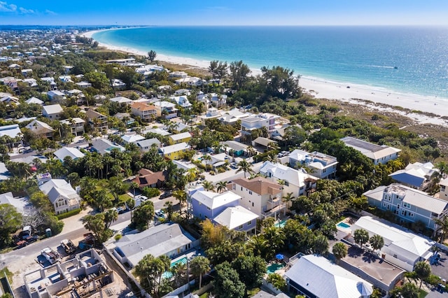 bird's eye view with a water view and a view of the beach