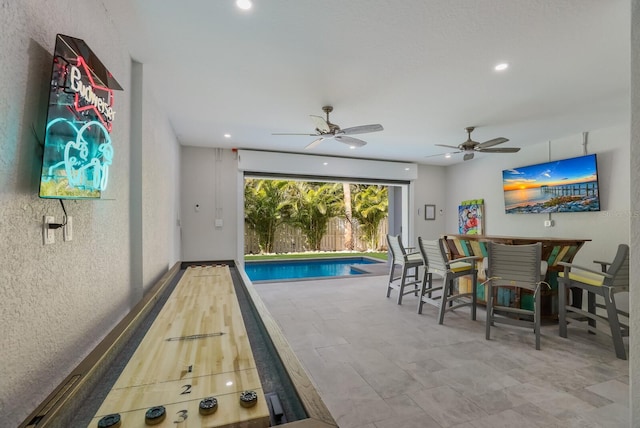 view of pool with ceiling fan