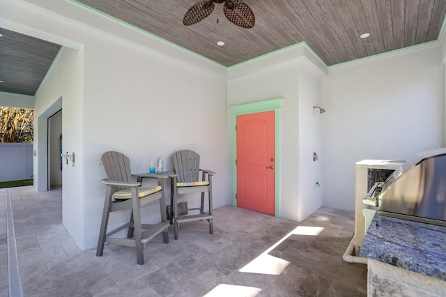 view of patio featuring ceiling fan