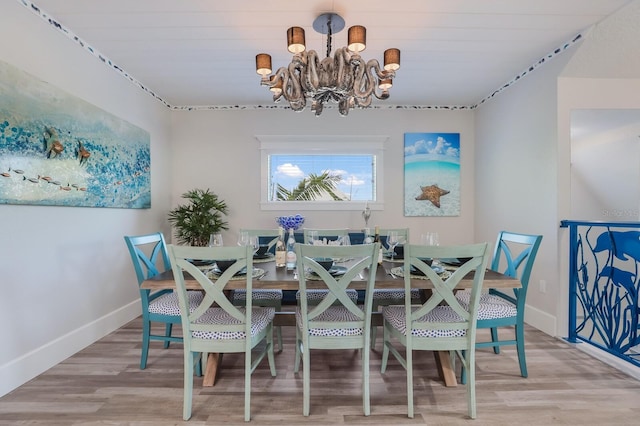 dining room featuring a chandelier and light hardwood / wood-style floors