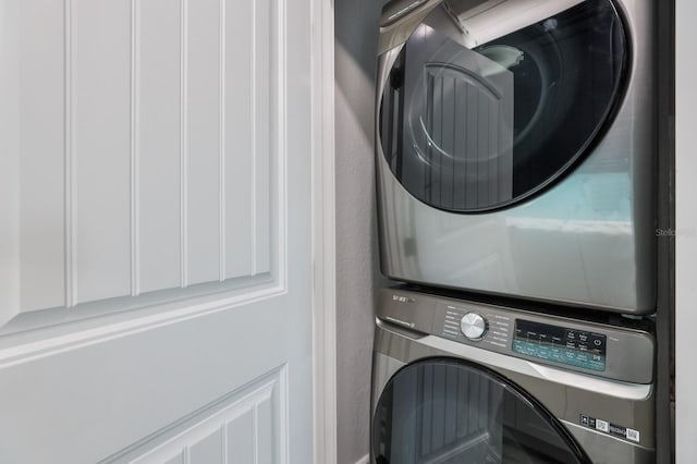 washroom with stacked washer and clothes dryer