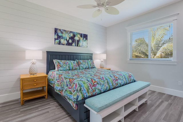 bedroom featuring hardwood / wood-style floors and ceiling fan