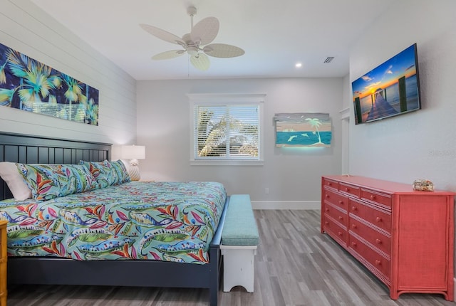 bedroom with ceiling fan and light wood-type flooring