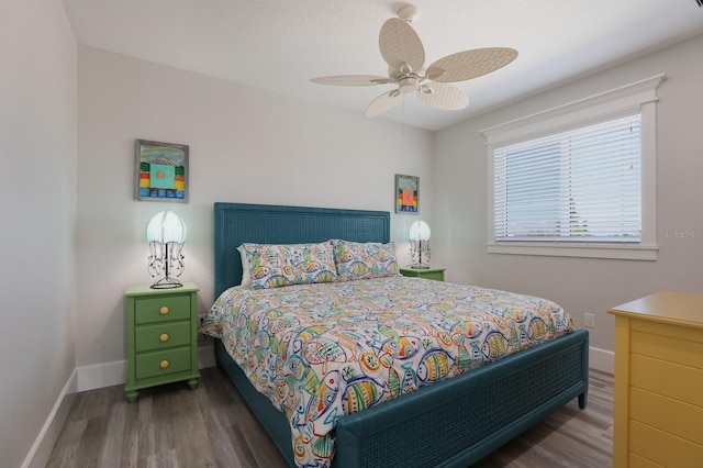 bedroom with ceiling fan and hardwood / wood-style floors