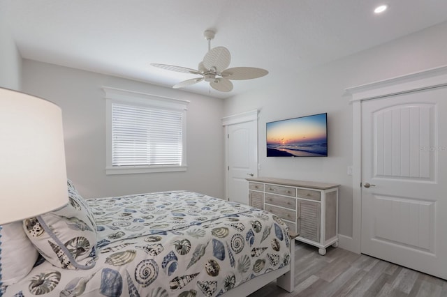 bedroom featuring ceiling fan and light hardwood / wood-style floors