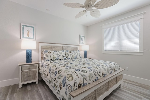 bedroom with hardwood / wood-style flooring and ceiling fan