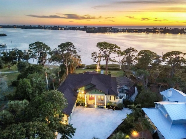 aerial view at dusk with a water view