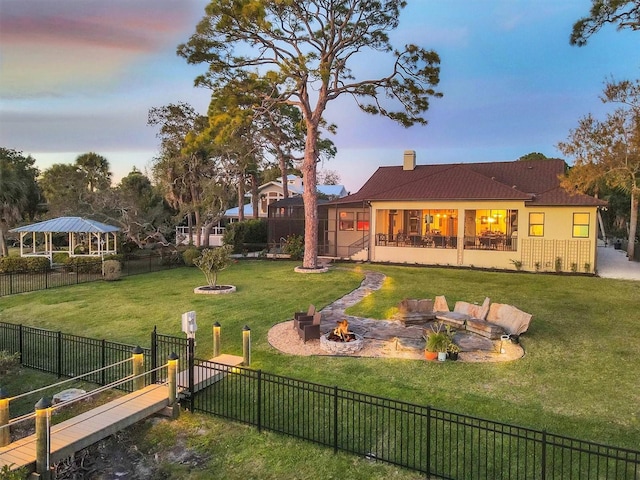 view of yard at dusk