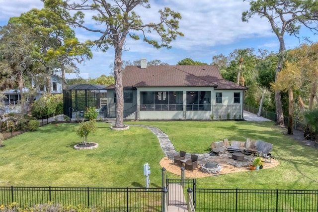 rear view of property featuring a lawn, an outdoor living space with a fire pit, a lanai, and a patio