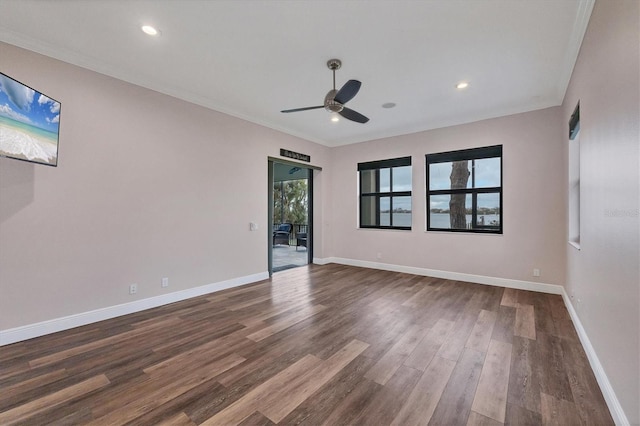 spare room with recessed lighting, baseboards, a ceiling fan, and dark wood-style flooring