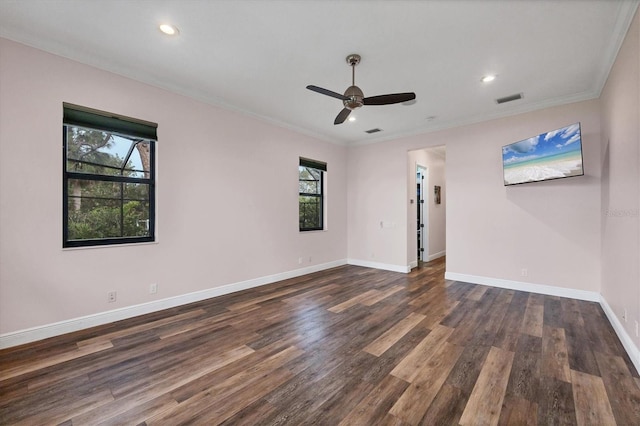 unfurnished room with dark wood-style floors, a ceiling fan, visible vents, and plenty of natural light