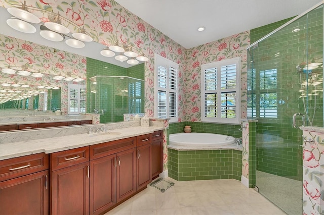 full bathroom featuring vanity, a shower stall, wallpapered walls, and a garden tub