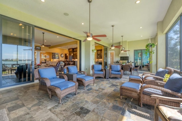 view of patio featuring outdoor lounge area and a ceiling fan