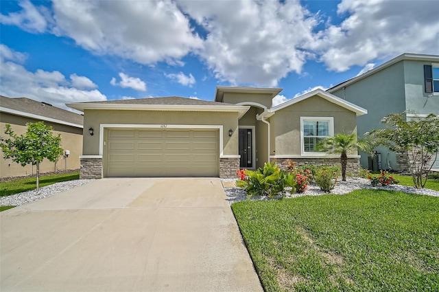 view of front of house with a garage and a front lawn