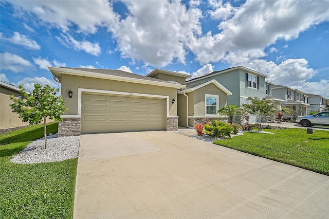 view of front of house featuring a garage and a front lawn