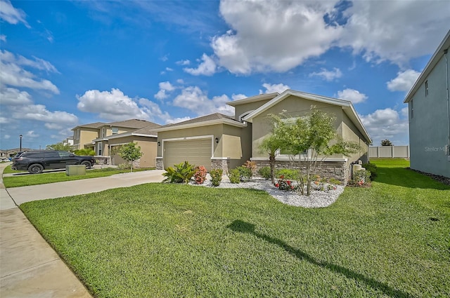 view of front of house featuring a garage and a front lawn